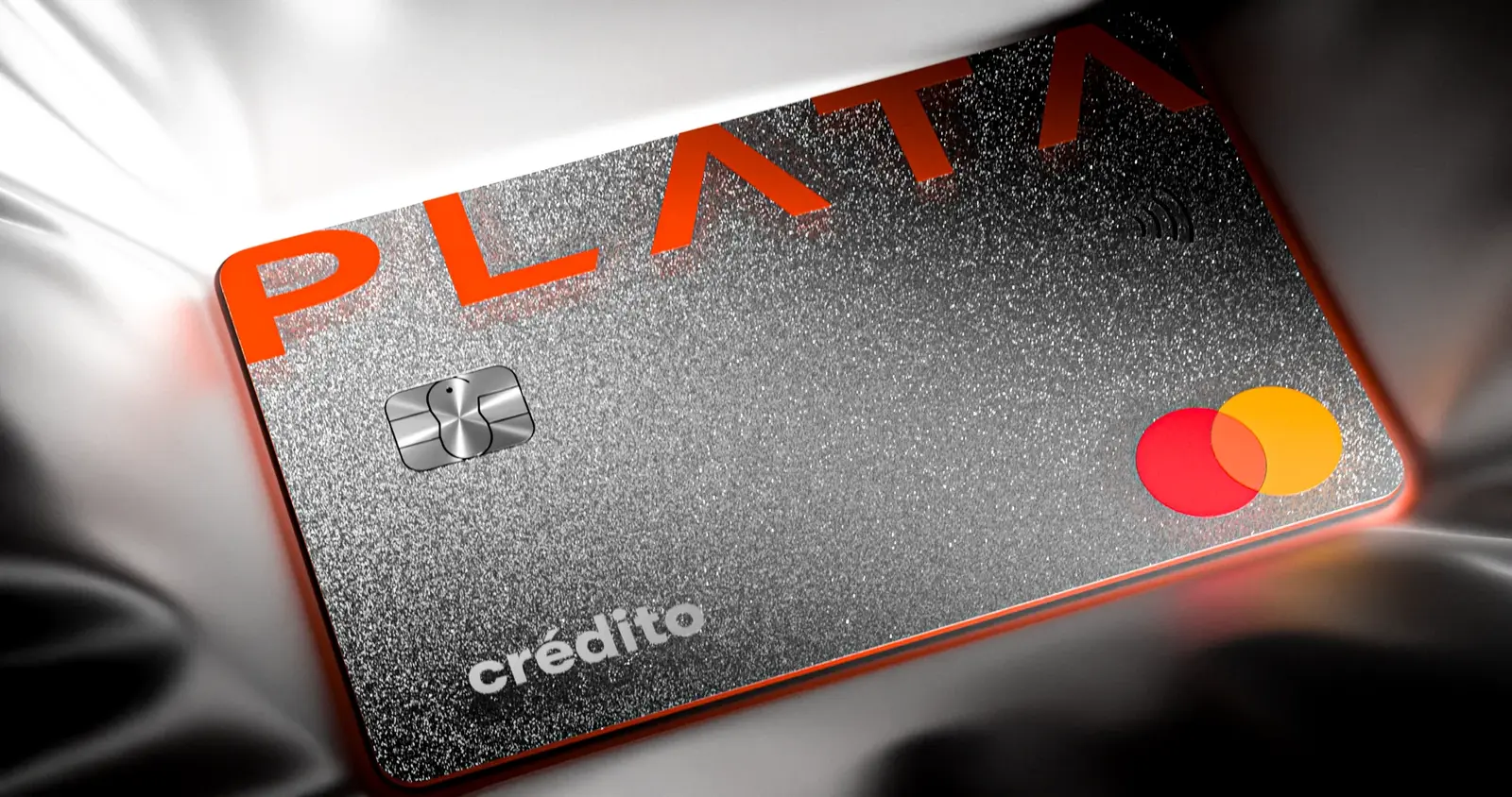 Metal payment card in a glowing fabric scene